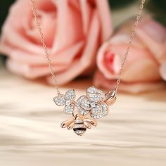 The center of the pendant showcases two delicate flowers made of sparkling stones. Symbolizing the blossoming love between two hearts. Beneath these captivating flowers, a graceful bee dangles, representing the sweet harmony of your connection. Just as the bee diligently gathers nectar for its hive, your love is a labor of love, continuously nurturing the sweetness of shared moments and experiences.Carat Weight: 1.507 ctStone Size: 1,1.2,2,0.8 mmStone Type: Jeulia® StoneNumber of Stones: 212 Sto Bee Flower, Bee On Flower, Delicate Flowers, The Bee, Two Hearts, Necklace Online, Delicate Flower, Flower Making, Sterling Silver Necklace