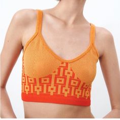 Orange Seamless Crop Top Zara Limitless Contour Collection. Size M-L Sleeveless Tank Features Round Neckline And A Pullover Closure Made Of 23% Polyester, 71% Nylon, And 6% Spandex Thank You For Visiting My Closet! Seamless V-neck Summer Tops, Trendy Summer Crop Top With Medium Support, Trendy Seamless Beach Tops, Trendy Orange Seamless Top, Trendy Seamless Sleeveless Tops, Trendy Sleeveless Seamless Top, Summer V-neck Seamless Crop Top, Trendy Sleeveless Top With Seamless Design, Fitted Seamless Crop Top For Summer