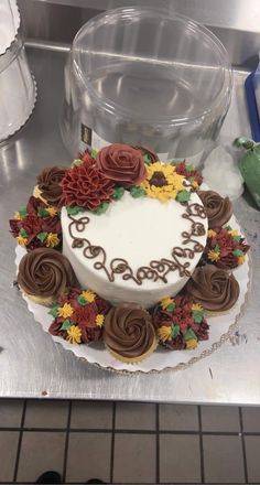 a decorated cake sitting on top of a metal counter