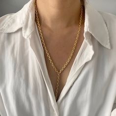 "18K Gold Chain Lariat Necklace | Chunky Chain Y Necklace | Gold Chain Link Layering Necklace | Long Drop Necklace | Statement Necklace  This seamless design lariat is made with gorgeous, solid gold tone chain with etched links that sparkle.  Perfect to layer it for everyday wear.  Super chic and minimal that goes well with all outfits. Lariat necklace with 3\" drop in the center. Check out more styles in our shop: https://jordanskyjewelry.etsy.com Handmade and designed in NY. ------------------------------- M A T E R I A L S  18 Karat gold plated - Non tarnish Stainless Steel Thanks for supporting our small business❤︎ --------------------------------  L E T ' S * C O N N E C T Check out @jordanskyjewelry on Instagram for sales and giveaways!   Enjoy your jewels!! xoxo" Y Necklace Gold, Long Drop Necklace, Necklace Outfit, Necklace Gold Chain, Lion Necklace, 18k Gold Chain, Long Silver Necklace, Y Necklace, Gold Long Necklace