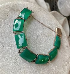 Art Deco Green Chrysoprase Sterling Siliver Vintage Antique Bracelet The bracelet measures 7 inches long See matching necklace in link below https://www.etsy.com/listing/897112044/art-deco-green-chrysoprase-sterling?ref=shop_home_active_1&frs=1 Usa Jewelry, Antique Bracelets, Handcrafted Necklace, Matching Necklaces, Chain Link Bracelet, Link Bracelets, Chain Link, Vintage Antiques, Vintage Items