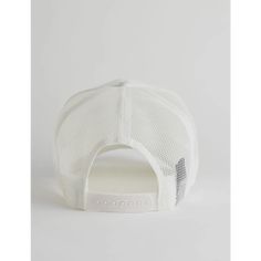 the white trucker hat is made from mesh and features an adjustable visor, front panel