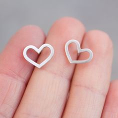 "These heart earrings are a special piece for a romantic nature and a great gift for her on a special occasion. They are great for everyday use and so lightweight, that you'll never feel them. The earrings are approx. 10 mm (3/8\") high. Choose material for the earrings (sterling silver or 9k gold). The earrings are made to order, so it'll take up to 5 days to ship them. You will receive them gift wrapped for no additional charge." Pierced Earrings As A Valentine's Day Gift For Her, Minimalist Nickel-free Heart Pendant Jewelry, Minimalist Nickel-free Heart-shaped Jewelry, Minimalist Heart-shaped Nickel-free Jewelry, Minimalist Heart Shaped Nickel-free Jewelry, Minimalist Nickel-free Heart Jewelry, Delicate Nickel-free Earrings As Gift For Her, Elegant Everyday Earrings For Valentine's Day, Elegant Hypoallergenic Heart Earrings For Everyday