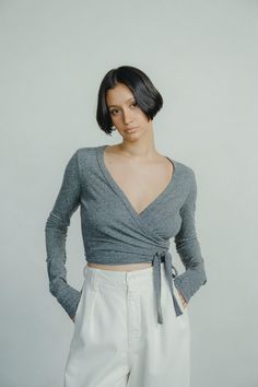 With a deep neckline and cropped cut, our Dance Wrap Top is a flattering, feminine play on a classic ballet wrap tee. Designed from our classic, beautifully textured 100% silk noil jersey, it’s made for customization, able to be styled both single and double-wrapped depending on how your preferred fit. An adaptable, any-season staple. V-neck Wrap Top For Loungewear, Fitted Faux Wrap Top With Surplice Neckline, Fitted Wrap Top With Surplice Neckline, Fitted Wrap Top With Faux Wrap And Surplice Neckline, Chic Wrap Tops For Loungewear, Fitted Wrap Top With Surplice Neckline For Fall, Elegant Cropped Top For Loungewear, Versatile Wrap Top For Loungewear, Fitted Faux Wrap Top For Spring