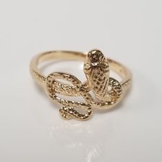 "Thanks for shopping our vintage estate store. We tend to sell well below wholesale and truly hope you enjoy all of our items. Many of the items are one of a kind, so please enjoy scrolling through the pictures and hopefully something will catch your eye. Brown spots are from the camera or reflections. Estate 14k yellow gold diamond cut snake ring. Just stunning ring. Ring size: 7 Setting: 5/8\" Band width: 2mm Weight: 2.66 grams Beautiful ring, one that you will love. Marked 14k." Beach Rings, King Ring, Snake Ring, Brown Spots, Gold Snake, Beautiful Ring, Ring Band, Ring Ring, Diamond Cut