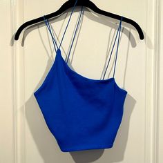 Size L Color Blue New With Tag Crop Top With Tiny Spaghetti Straps. 95% Cotton And 5% Elastane (Spandex) Trendy Blue Spaghetti Strap Crop Top, Blue Crop Top With Built-in Bra And Spaghetti Straps, Trendy Blue Tops With Straps, Blue Camisole Crop Top With Straps, Blue Seamless Crop Top With Spaghetti Straps, Trendy Blue Spaghetti Strap Tank Top, Blue Crop Top With Spaghetti Straps And Built-in Bra, Blue Seamless Spaghetti Strap Crop Top, Blue Spaghetti Strap Crop Top For Summer