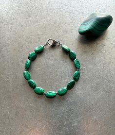 💎Hand made by a single artist in the USA 💎Genuine, natural, semi-precious gemstones 💎Malachite to soothe and promote growth and abundance 💎Steel lobster claw style closure 💎7.25 inches-- can be altered upon request. 💎One-of-a-kind piece Denver Co, Precious Gemstones, Semi Precious Gemstones, Lobster Claw, Beaded Bracelet, Semi Precious, Beauty Book, Jewelry Bracelets, Hand Made