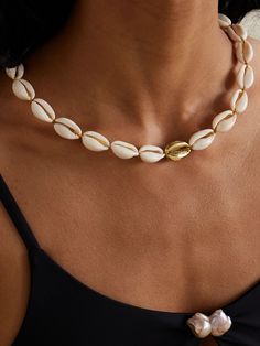 Tohum's pieces are always inspired by the beauty of the natural world. A perfect example, its 'Concha Puka' necklace is handmade in Istanbul using cowrie shells sourced from Turkey and strung together with metallic cord. The central charm is made from 24-karat gold-plated metal for a gleaming finish. Puka Necklace, Puka Shell Necklace, Cowrie Shells, Flat Dress Shoes, Floral Dresses Short, Puka Shell, The Natural World, Shell Necklace, Shell Jewelry