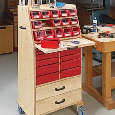 a workbench with many drawers and tools on it