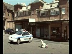 a police car parked in front of a building