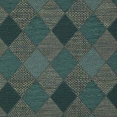 an upholstered area rug with blue and grey squares