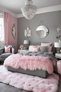 a pink and grey bedroom with fur rugs on the floor, chandelier