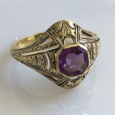 Details: Victorian 14K gold Art Deco amethyst ring circa 1930's. Beautiful deco design, with leaf inspired pattern. The lovely amethyst measures 6.7mm x 6.7mm, and sits about 5.5mm from the finger. The setting measures 15.4mm from top to bottom. The ring is in excellent condition. Please ask all necessary questions prior to placing an order. Measurements: The size is 7 US and can be sized for a fee. Condition: The overall all condition of this ring is excellent condition and the stone is securel Classic Amethyst Ring Stamped 14k, Formal Purple Amethyst Ring In 14k Gold, Formal 14k Gold Purple Amethyst Ring, Heirloom 14k Gold Round Cut Amethyst Ring, Art Deco Yellow Gold Amethyst Ring, Art Deco Amethyst Ring In Yellow Gold, Yellow Gold Amethyst Ring In Art Deco Style, Art Deco Purple Amethyst Ring For Formal Occasions, Purple Amethyst Art Deco Ring For Formal Occasions