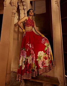 Experience the beauty and comfort of this gulshaad sharara set featuring an intricately embroidered blouse with a stylised back design with heavy tassels and doris coordinated with floral design sharara pants. Perfect outfit to turn heads and make a bold style statement. Floral Print Semi-stitched Sharara For Reception, Festive Anarkali Palazzo Set With Floral Embroidery, Bollywood Style Floor-length Palazzo Set With Floral Embroidery, Navratri Floor-length Sets With Floral Embroidery, Bollywood Style Saree Palazzo Set With Floral Embroidery, Bollywood Style Floor-length Floral Embroidered Palazzo Set, Bollywood Style Floral Embroidered Floor-length Palazzo Set, Bollywood Style Floral Embroidery Floor-length Palazzo Set, Red Sharara With Floral Embroidery For Navratri