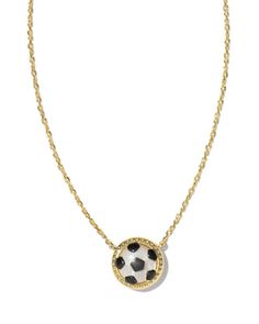 a necklace with a black and white soccer ball in the center on a gold chain