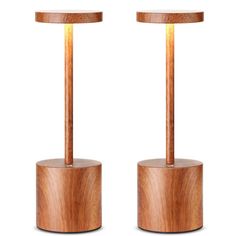 two wooden lamps with one light on each side and the other turned on in different directions