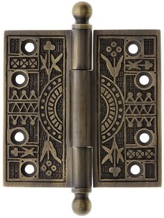 an antique brass door hinge with decorative designs