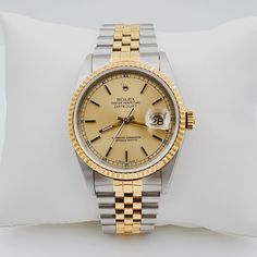 Men's Rolex 36mm DateJust 18K Gold / Stainless Steel Two-Tone Watch with Champaign Dial and Fluted Bezel. UNWORN SN# U98**** Year: 1998. Brand: Rolex. Gender: Men's. Crystal: Plastic. Case Back: Solid. Condition: Unworn. Dial Color: Champaign. Model: DateJust 16233. Case Dimensions: 36mm. Bezel Color: 18K Yellow Gold. Movement: Mechanical (Automatic). Metal Type: 18K Gold / Stainless Steel. Bracelet / Strap: 18K Yellow Gold / Stainless Steel. Box / Certificate: Rolex Box / Certificate of Authent Yellow Gold Automatic Watch Accessories For Formal Occasions, Formal Yellow Gold Automatic Watch Accessories, Formal Diamond Watch With Date Display, Gold Diamond Watch With Chronometer For Business, Gold Diamond Chronometer Watch For Business, Elegant Yellow Gold Watch With Date Display, Formal Yellow Gold Automatic Watches, Formal Yellow Automatic Watch, Timeless Yellow Gold Watches With Date Display