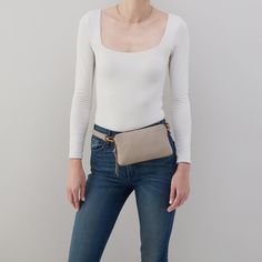 Go handsfree and travel light with the Fern Slim Belt Bag. Fern Slim Belt Bag In Pebbled Leather  Taupe BELT BAGSLING in Taupe | Hobo® Chic Leather Pouch With Cell Phone Pocket, Versatile Everyday Mobile Phone Pouch, Versatile Belt Bag For On-the-go, Rectangular Beige Belt Bag For On-the-go, Everyday Versatile Mobile Phone Pouch, Leather Mobile Phone Pouch For On-the-go, Everyday Soft Leather Crossbody Pouch, Versatile Pouch With Adjustable Strap For On-the-go, Beige Leather Belt Bag For On-the-go