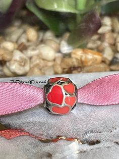 Authentic and retired Pandora Red hot Love hearts charm on ribbon in a gift box with tissue and box sticker.  A beautiful charm used to create a bracelet full of memories.  Just part of my collection that set in my velvet lined jewelry box. Professionally cleaned and in new condition.  This item will ship USPS same day as purchase.  Please see all photos as trademarks have been photographed and shown in every listing as proof of authenticity.  A gorgeous piece to add beauty to any Pandora bracelet.  .  If you have any questions feel free to ask.  Happy Etsy shopping! Pandora Red, Bracelet Pandora, Pink Envelopes, Pandora Bracelet, Red Hot, Cute Pink, Pandora Charms, Heart Charm, Gift Box