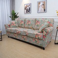 a living room filled with furniture and pictures on the wall