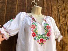 An ethnic, summer festive floral top that is embellished with embroidery. Estimated size medium. Condition - good used. Measurements taken across front laid flat - double where appropriate Bust21"  Waist21"  length24" Peasant Tops, Floral Tops, Womens Clothing Tops, Blouses For Women, Pastel, Bathing Beauties, Tops & Tees, Festival, Purses And Bags