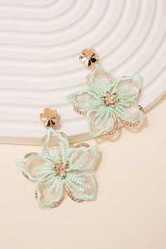 Make a statement with these beautiful Rhinestone Fabric Flower Earrings. These earrings are handmade with fabric flowers, embellished with shimmering rhinestones, creating a stunning and eye-catching look. Perfect for any special occasion or to add a touch of glamour to your everyday look. Shop now and add these unique earrings to your jewelry collection today! Size Length: 2.5 in (6.35 cm)Width: 2 in (5.08 cm) QualityEarrings are layered with two different flowers. Bottom flower with rhinestone Spring Party Flower Earrings With 3d Flowers, Spring Party 3d Flower Earrings, Green Flower Earrings For Party, Fabric Flower Earrings, Flower Earrings Diy, Rhinestone Fabric, Bff Jewelry, Pearl Shop, Black Peach