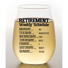 a wine glass with the words retirement schedule written in black and white on it, sitting next to a bottle of wine