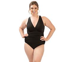 Hit the beach in confidence and style thanks to this classic one-piece swimsuit featuring a V-neck and sewn-in cups. It's crafted from stretchy, form-fitting fabric for a just-right fit. From Dolfin. V-neck Tankini For Swimming, Stretch V-neck Tankini For Swimming, Seamless Fitted V-neck Swimwear, Stretch V-neck Shapewear Swimwear, Shapewear Stretch Tankini For Poolside, Stretch Shapewear Tankini For Poolside, Poolside Stretch Shapewear Tankini, V-neck Elastane Stretch Swimwear, Stretch Shapewear Swimwear For Pool