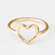 ♥ Real Gold Ring ♥A cute heart ring, perfect for somebody who likes simple and classic jewelry. The band is 10K Yellow Gold and about 1mm round. The heart itself is just under 1/2 an inch from the bottom point of the heart to the top of the heart. These are made in our studio, so we can make it any size you like :) The ring will be polished to a high mirror finish and sent in a white gift box.D E T A I L S• Made to Order in any size• Genuine 14K Gold (Rose, Yellow or White)• The thickness of app Gold Heart Ring For Valentine's Day, Cute Gold Heart Ring For Valentine's Day, Cute Heart Ring For Valentine's Day Anniversary, Heart Shaped Stackable Rings For Valentine's Day, Cute Gold Heart Promise Ring, Simple Heart Promise Ring For Valentine's Day, Simple Heart Ring For Valentine's Day, Simple Gold Heart Ring For Valentine's Day, Simple Heart-shaped Rings For Valentine's Day