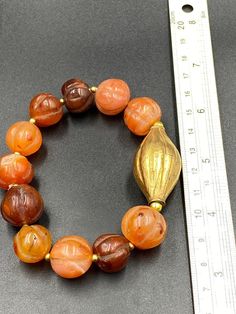 Old ancient carnelian pumpkin shape beaded bracelet Artisan Gemstone Beads Round Bracelets, Elegant Amber Bracelets With Polished Beads, Amber Carnelian Beaded Bracelet Gift, Amber Carnelian Beaded Bracelets - Gift, Unique Hand-strung Gold Beaded Bracelets, Handmade Orange Spiritual Bracelets, Vintage Gemstone Beads Jewelry For Healing, Orange Round Faceted Beads Jewelry, Handmade Orange Agate Bracelet