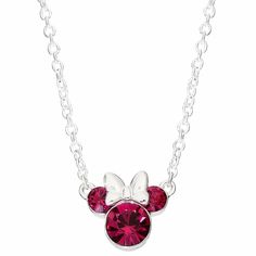 a minnie mouse necklace with swarong crystals on it's back and silver chain