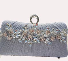 Fabulous design with a glittering touch.  Perfect finishing touch for any formal outfit.  Ideal for cocktail party or wedding.  Can be made in silver, gold or black. Elegant Rectangular Sequin Clutch, Rhinestone Clutch Evening Bag For Wedding Guest, Silver Glamorous Evening Bag For Party, Elegant Rectangular Evening Bag With Sequins, Glamorous Party Clutch With Bling, Glamorous Bling Evening Bag For Party, Elegant Evening Bag With Bling For Parties, Elegant Clutch With Bling For Events, Elegant Evening Bag With Bling For Events