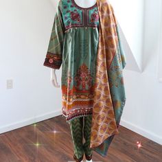 Beautiful Embroidered Frock With Printed Trouser And Dupatta. Size M Bust 40", Waist 37", Shirt Length 38". Green Embroidered Cotton Lawn Suit, Bohemian Green Salwar Kameez With Printed Motifs, Green Cotton Dress With Dupatta, Green Cotton Chikankari Embroidered Dress, Green Cotton Dress With Chikankari Embroidery, Green Embroidered Lawn Suit For Spring, Summer Cambric Dresses With Printed Motifs, Spring Embroidered Green Lawn Suit, Cotton Dresses With Dupatta For Spring