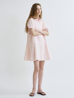 This is a trendy and feminine dress by ANEDIT that is made out of high quality and sturdy material. With distinctive mood of the design and modern feminine look, you can style it for your comfortable daily outfit.- Feminine mood and soft touch- Semi loose silhouette- Subtle puff sleeves and flared skirt- Out pocket detail on the chest Feminine Cotton Shirt Dress For Day Out, Pink Cotton Shirt Dress For Day Out, Pink Cotton Midi Dress For Daywear, Pink Relaxed Fit Mini Dress For Spring, Feminine Spring Cotton Shirt Dress, Feminine Cotton Shirt Dress For Spring, Pink Short Sleeve Midi Dress For Work, Relaxed Fit Pink Shirt Dress For Summer, Feminine Cotton Mini Dress For Work