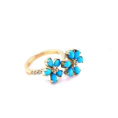 This ring has 11 Pear Cut Turquoise stones that weigh a total of 1.78 Carats and is embellished with 17 Round Cut Diamonds that weigh 0.22 Carats (Clarity: SI1, Color: F). The total carat weight of the ring is 2.00 Carats. The ring is crafted in 14 Karat Yellow Gold and weighs approximately 4.9 Grams. The ring is a size 7  Exact dimensions for this item are unknown. Please reach out in the seller Q&A for any questions on measurements. Luxury Turquoise 14k Gold Ring, Luxury Hallmarked Yellow Gold Turquoise Ring, Luxury Multi-stone Turquoise Ring For Formal Occasions, Luxury Multi-stone Gold Turquoise Ring, Formal Gold Turquoise Ring, Fine Jewelry, Yellow Gold Cocktail Ring, Gold Cocktail, Gold Cocktail Ring, Round Cut Diamond