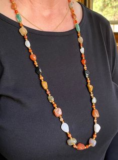 Timeless natural agate gemstone necklace that is at least 50 years old. Agates separated by small agate and gold metal beads to add the sparkle. Gold Agate Beaded Necklace With Polished Beads, Long Agate Beaded Necklace With Polished Beads, Gold Beaded Agate Necklaces, Gold Aventurine Beaded Necklaces, Gold Single Strand Agate Necklace, Gold Agate Beaded Crystal Necklaces, Gold Agate Beaded Necklace With Natural Stones, Gold Beaded Agate Crystal Necklaces, Gold Chalcedony Gemstone Beads Necklace