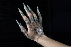 HAND FINGER CLAWS DIABLO Metal Glove with Claw rings connected with chains. ************************************************ All claws, rings and bracelet are fully adjustable. Available in Silver and Bronze Tone. - The set for both hands is always 10% off compared to the set for one hand. Fingers Covered In Rings, Hand Drawing Rings, Futuristic Hand Jewelry, Fantasy Claw Jewelry For Party, Fantasy Jewelry With Claw Shape For Party, Silver Punk Costume Jewelry, Punk Style Silver Jewelry For Costumes, Silver Punk Jewelry For Costume, Halloween Silver Claw Jewelry