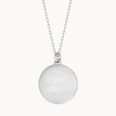 Our weighted Personalized Locket Necklace Sterling Silver can be hand-engraved on the inside and out, keeping your loved ones and special memories close to heart.925 Sterling SilverLoquet charm: 0.8 diameterSecure clasp fasteningCharms are removable from this chain and can be worn on all Merci Maman chain lengthsHand-engraved in our Paris studioSent with love in a complimentary gift boxAny slight variations in lettering depth, spacing and alignment from the examples shown are part of the aesthetic and originality of the piece Sterling Silver Medallion Necklace With Silver Clasp, Engraved White Gold Stainless Steel Jewelry, Silver Oval Sterling Silver Charm Necklace, Oval Silver Sterling Silver Charm Necklaces, Silver Sterling Oval Charm Necklaces, Engraved Stainless Steel Heart Pendant Jewelry, Sterling Silver Medallion Necklace With Polished Finish, White Gold Pendant Charm Necklace With Lobster Clasp, Personalized Silver Jewelry With Engraving Option