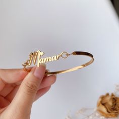 This bangle is handmade according to your names and size,High-quality gold plating, lasting color retention,3 mm width is very dainty,If you order this for baby,we could make it according to the size the baby need,just note the size please. Material： stainless steel, high-quality 18 K gold Plated(High quality Color retention) Size: Bangle width: 3 mm, Name plate size: about 8 mm*35 mm(Adjust according to name length) Custom: 1, Select the color and size you need. 2, Input the name and font you w Personalized Gold Name Bracelet As Gift For Mom, Personalized Gold Name Bracelet For Mom, Adjustable Custom Name Bracelet Bangle, Custom Name Bangle Bracelets For Mother's Day, Adjustable Custom Name Bangle As Gift, Gold Bangle With Custom Name For Gift, Custom Name Adjustable Bangle For Gift, Custom Name Adjustable Bangle As Gift, Gold Name Bracelet As Gift For Mom