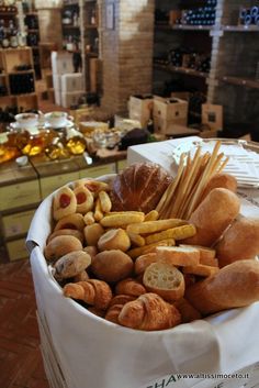 a white basket filled with lots of different types of food on top of a table