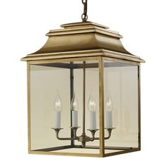 a light fixture with three candles hanging from the front and back of it, against a white background