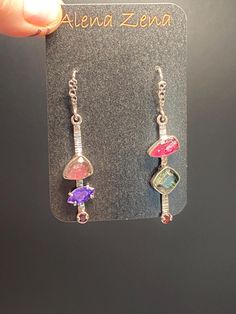 Mismatched Pink&Green Tourmaline with Amethyst and Garnet Earrings in sterling silver  Materials: Silver 925, Pink&Green tourmaline, Garnet, Amethyst  Height - 2", width - 3/8" Unique Handcrafted One-of a-kind Design Earrings Each Piece of Jewelry in my Collection is Absolutely One of a Kind! When you start wearing a piece of my jewelry you will fall in love with it more and more each day and feel that good Energy and Love that I pass into it while creating this piece of Art. A piece of Art crea Fusion Multi-stone Pink Jewelry, Artistic Purple Jewelry With Matching Earrings, Artistic Wire Wrapped Drop Earrings, Fusion Style Wire Wrapped Drop Earrings, Nickel-free Fusion Style Dangle Jewelry, Fusion Style Nickel-free Dangle Jewelry, Fusion Nickel-free Dangle Jewelry, Fusion-style Nickel-free Dangle Jewelry, Artistic Nickel-free Purple Jewelry