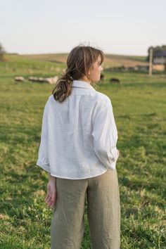 "An Oversized Linen Shirt is for sure a wardrobe staple for all times. Classic modest style is moderately embellished with stylish patch pockets. This white button up shirt can be favorably combined both with loose and classic bottoms. A slightly cropped design delicately hints at the waistline. Thus, it creates a perfect balance to a current-day trend on oversized clothes. DETAILS ⚬ Spread collar. ⚬ Patch pockets are decorated with handmade fancy stitches. ⚬ Button fastening. ⚬ 3/4 sleeve. ⚬ Sl Clothes Details, Oversized Linen Shirt, White Button Up Shirt, Oversized Clothes, White Linen Shirt, Modest Style, White Button Up, Womens Blouses, Shirt Button