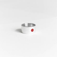 Symbol of sun - red circle on the white background. It's first association with Japan. Sun in Japan is symbol of honourable Imperator. We took leadership and strength from this meaning and put into this ring. Combination of red and white is combination of clearing energy of the sun and prime purity. On the other side of the ring is hieroglyph of the sun 太陽.  New autumn/winter collection! Gift for all who loves minimalism and simplicity of japan culture. Details:  Width: 10 mm Thickness: 1.2 mm Materials: sterling silver 925, enamel The surface has structure that does not cling or scratch. Please read my shipping and policies tab for shipping info.  All items are packaged in moisture resistant packaging to ensure they arrive in perfect condition. Don't hesitate to contact me with any questi Modern Red Open Ring, Minimalist Red Ruby Ring, Minimalist Red Open Ring, Red Minimalist Sterling Silver Ring, Minimalist Red Sterling Silver Ring, Modern Red Ruby Ring, Modern Red Ruby Ring In Sterling Silver, Minimalistic Ring, Japanese Sun