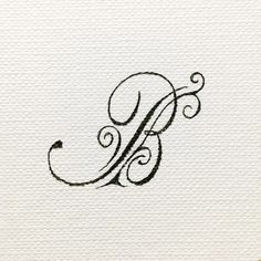 the letter b is made up of swirls and curls on white paper with black ink