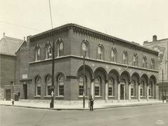 an old black and white photo of a building