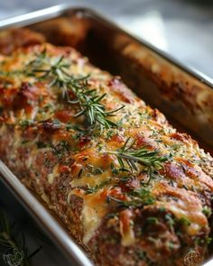 a casserole dish with meat and vegetables in it