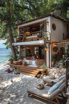 a house on the beach with an ocean view