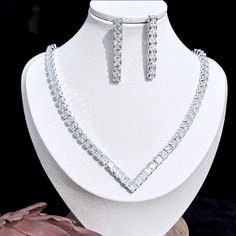 A beautiful three-piece bridal jewelry set that will add elegance and sophistication to any wedding gown or formal ensemble! Adorned with intricately faceted cubic zirconia that capture the light from every angle with a perfectly translucent appeal, the pieces are platinum / 14K yellow gold plated for a flawless finish which enhances the intricate detailing and conveys a modern take on old elegance. Necklace: 17.7" (approx. 45cm) long with a secure fold-over closure (a 2" extension chain can be Elegant Silver Bridal Sets With Rhinestones, Elegant Diamond White Bridal Sets With Sparkling Stones, Elegant Cubic Zirconia Bridal Sets, Wedding Jewelry Sets In White Gold With Diamond Accents, Elegant Silver Bridal Sets, Elegant Bridal Sets With Rhinestones And Crystal, Elegant Diamond White Jewelry Sets With Rhinestones, Elegant Formal Crystal Bridal Sets, Elegant Crystal Bridal Sets With Rhinestones